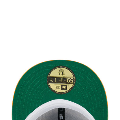 Green cap underside with circular interior label and stitched brim edge