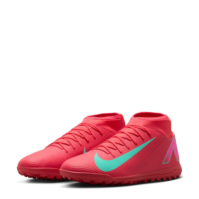 Men's red turf soccer shoes, front 3/4 view with turquoise swoosh and studded sole