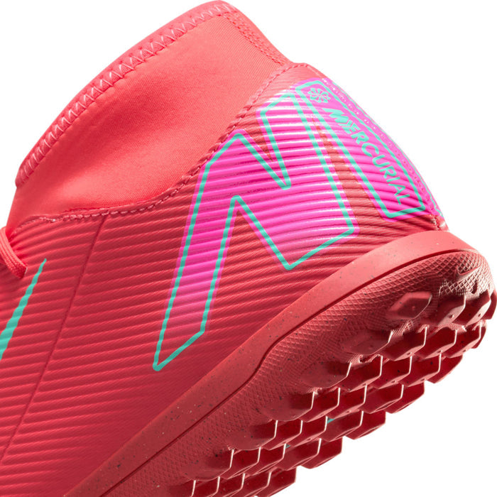 Men's red turf soccer shoes close-up of upper texture and turquoise N-style logo
