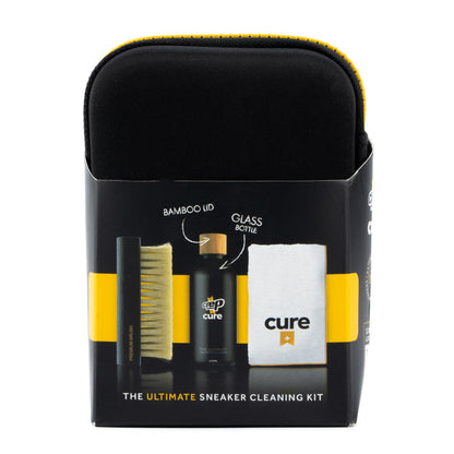 Sneaker cleaning kit box showing black brush, bamboo brush, and white-yellow cloth