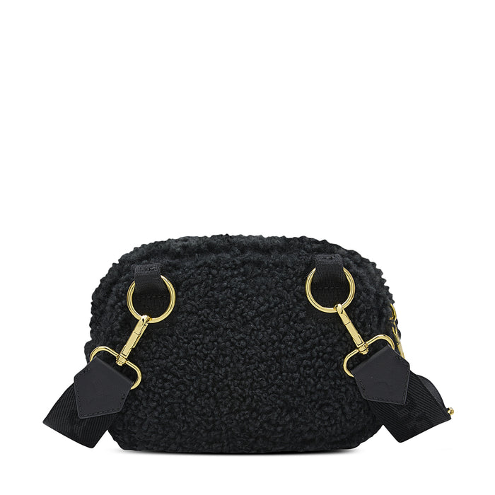 Black sherpa camera bag front with gold top rings and attached strap tabs