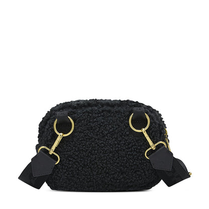 Black sherpa camera bag front with gold top rings and attached strap tabs