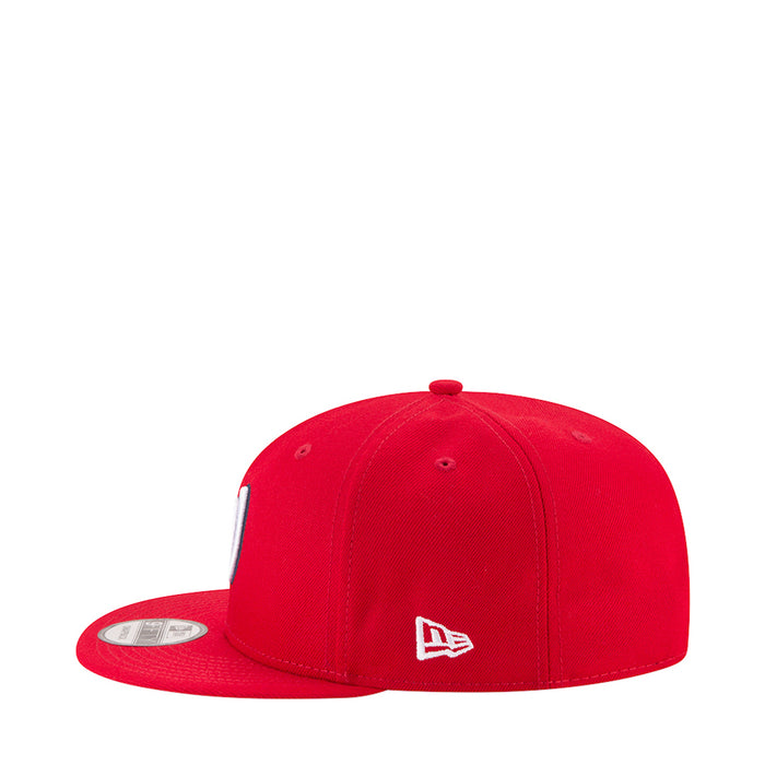 Red baseball cap with small New Era logo on front, curved brim
