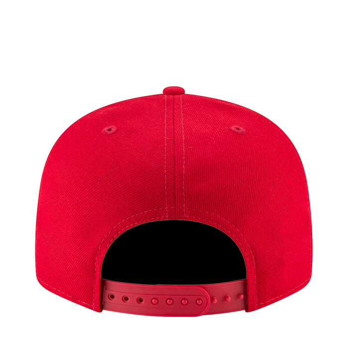 Red baseball cap with open back vent and adjustable strap