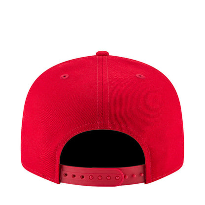 Red baseball cap with open back vent and adjustable strap