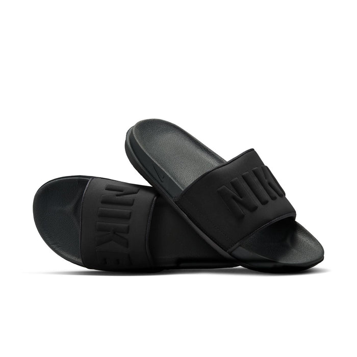 Women's black slide sandals in pair view with NIKE logos on straps