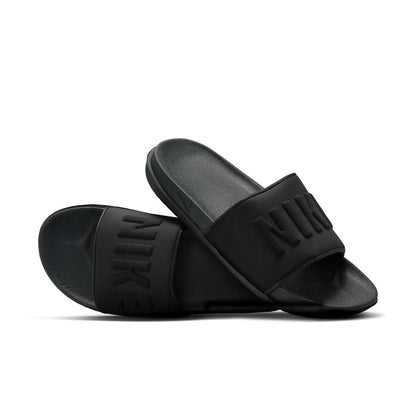 Women's black slide sandals in pair view with NIKE logos on straps