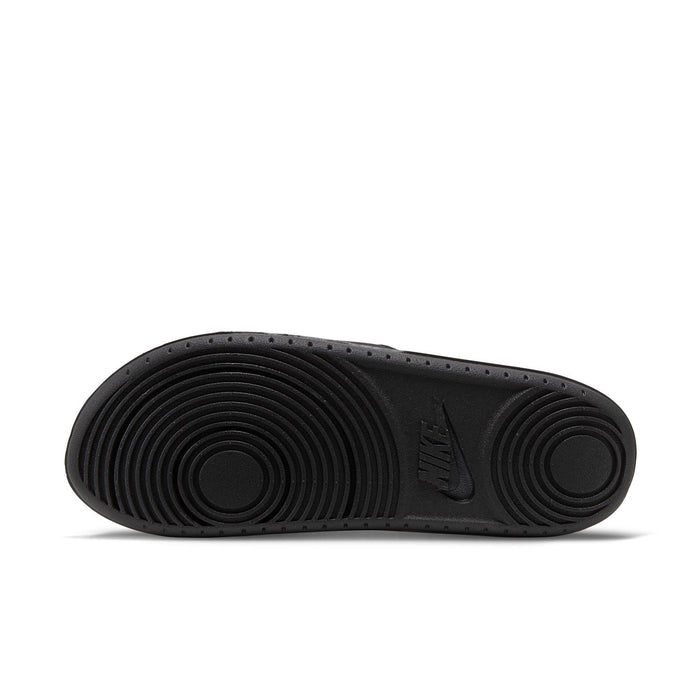 Women's black slide sandal outsole with concentric tread and NIKE mark