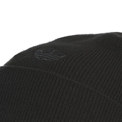 Black knit beanie close-up of three-bar logo on cuff