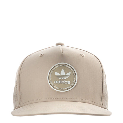 Light beige snapback cap with adidas circular emblem on the front.
