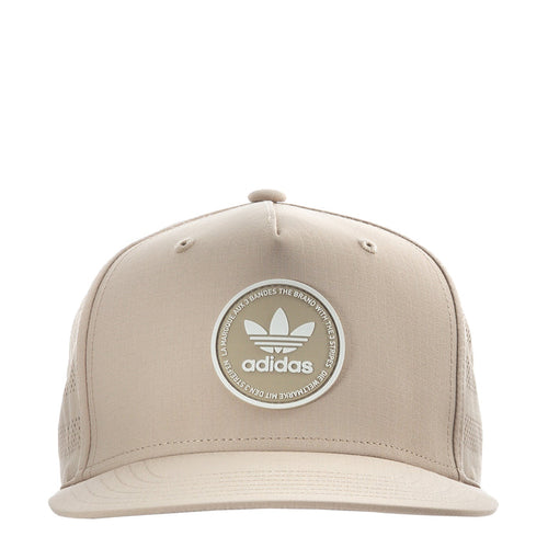 Light beige snapback cap with adidas circular emblem on the front.