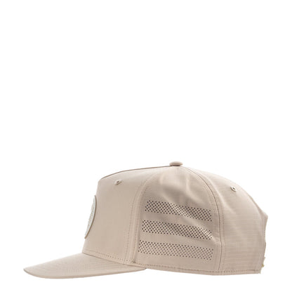 Light beige snapback cap with perforated side stripes and curved brim.