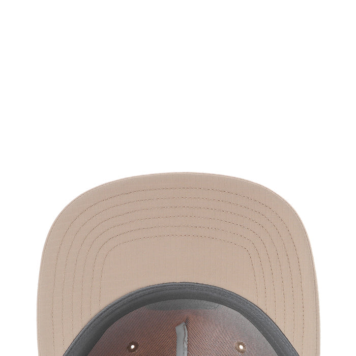 Light beige cap crown close-up with ventilated stitching on the brim.