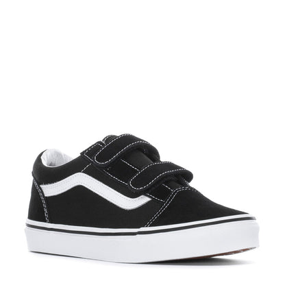 Youth black skate shoe with Velcro closure, white stripe detail, low profile sole