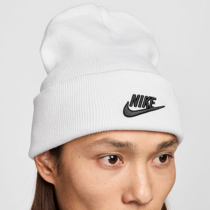 White ribbed knit beanie with black Nike swoosh logo