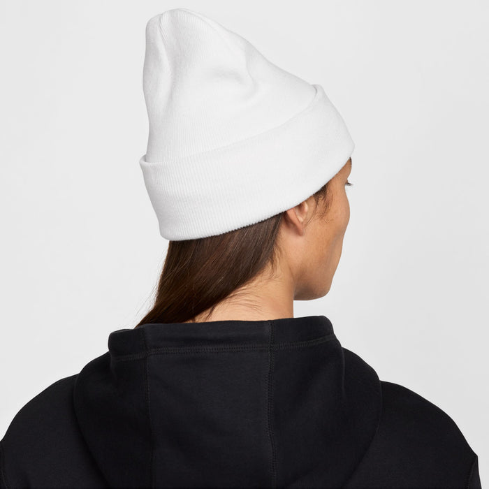 White knit beanie side view with black Nike swoosh logo