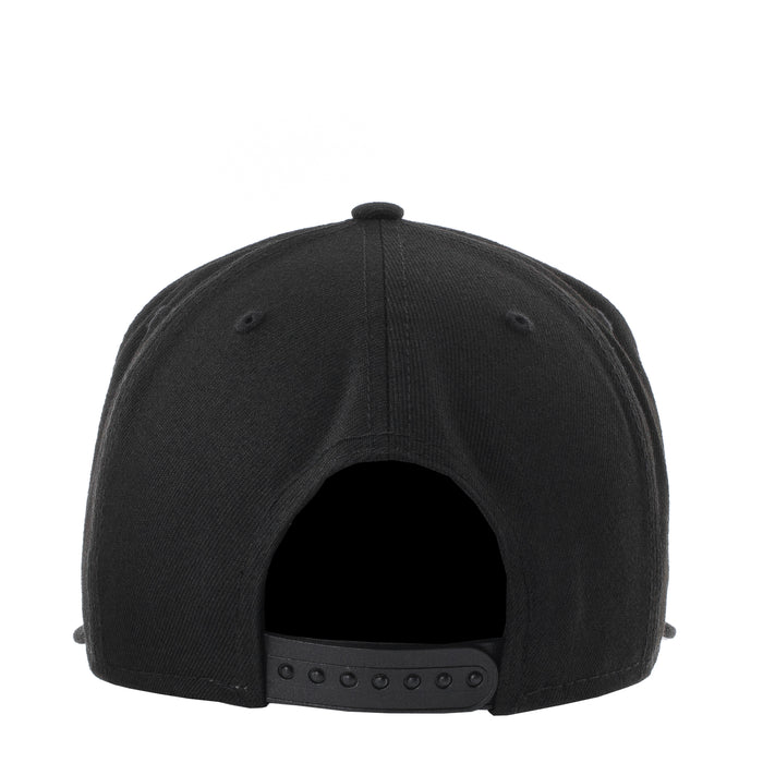 Black baseball cap rear view with buttoned strap and ventilation holes
