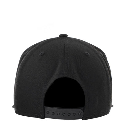 Black baseball cap rear view with buttoned strap and ventilation holes