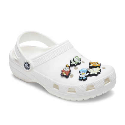 Pokemon Jibbitz charms on white clogs, five colorful character pieces