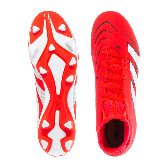 Red and white soccer cleat outsoles with molded studs and black upper laces