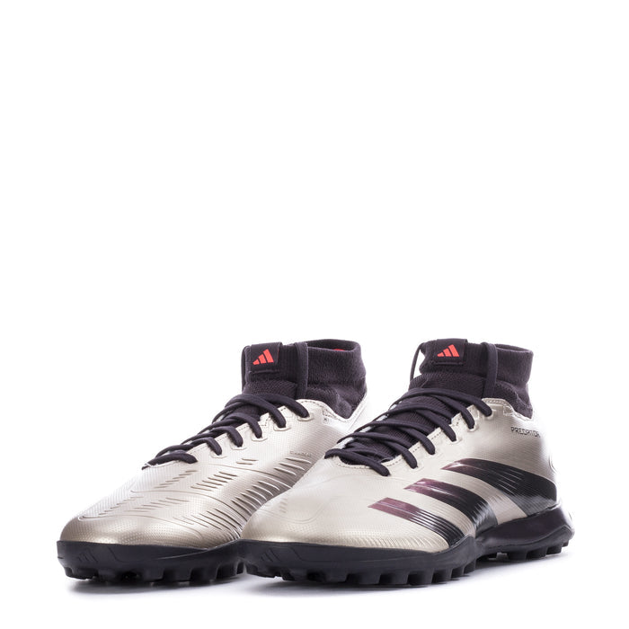 Pair of men's mid-cut TF soccer cleats, metallic silver with black socks and purple accents