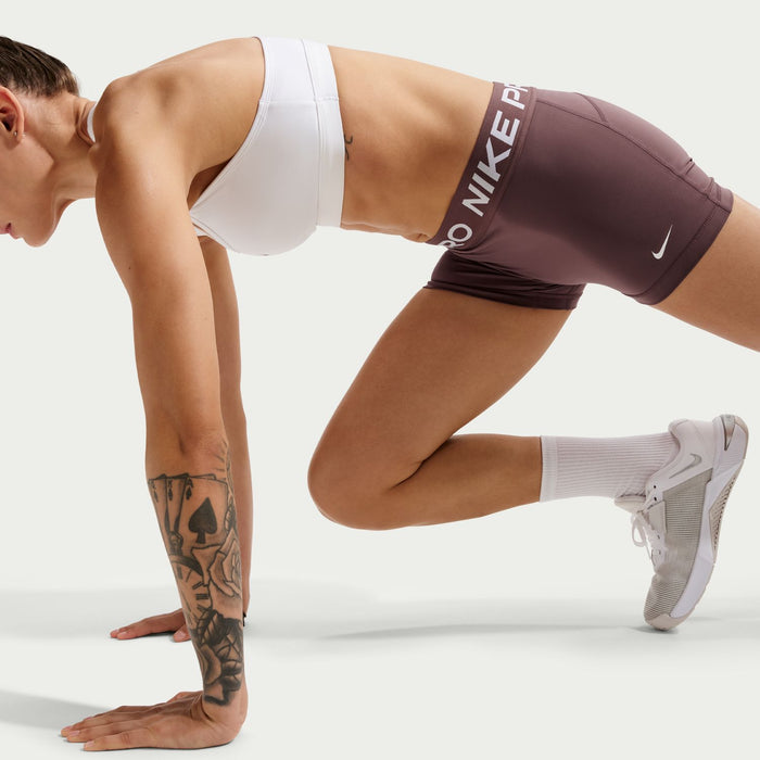Women’s 3-inch performance shorts, dark mauve with Nike Pro waistband logo.