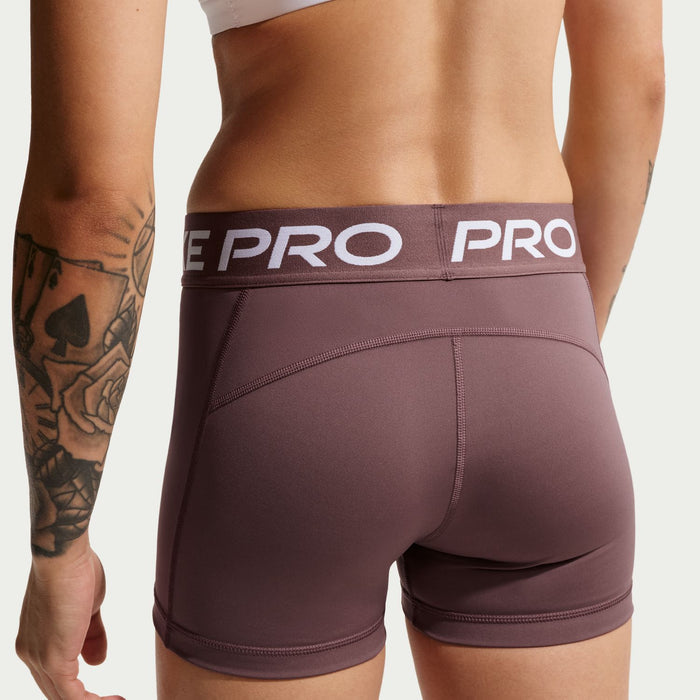 Women’s 3-inch performance shorts, dark mauve with Nike Pro branded waistband.