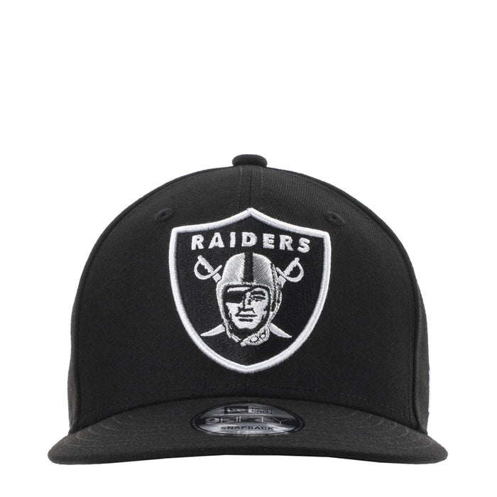 Black snapback cap with Raiders shield logo at front in contrast white outline