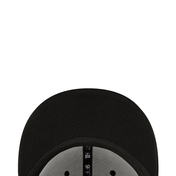 Black cap brim interior close-up with New Era label on the underside
