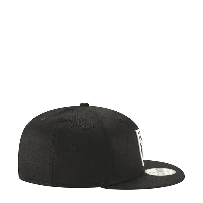 Black Raiders logo cap, side profile view with curved brim and snapback