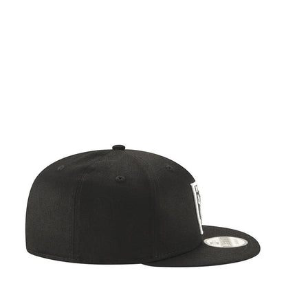 Black Raiders logo cap, side profile view with curved brim and snapback