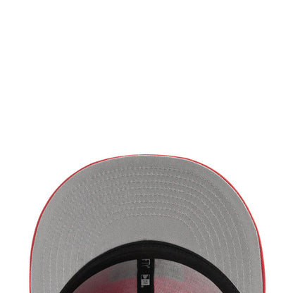 Gray cap brim underside with black band trim and stitched edge