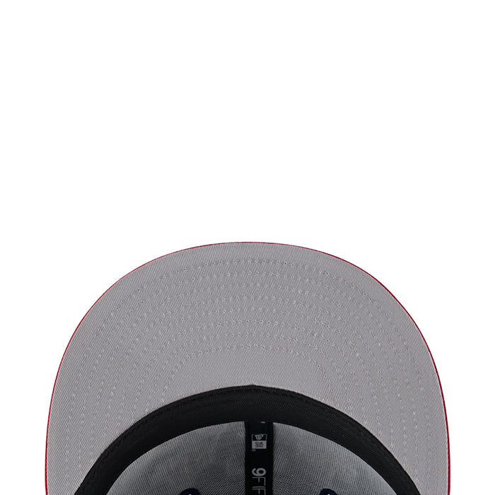 Two-tone cap interior lining in gray with black trim and small size label.