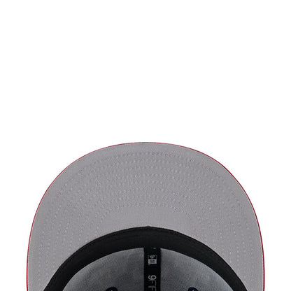 Two-tone cap interior lining in gray with black trim and small size label.