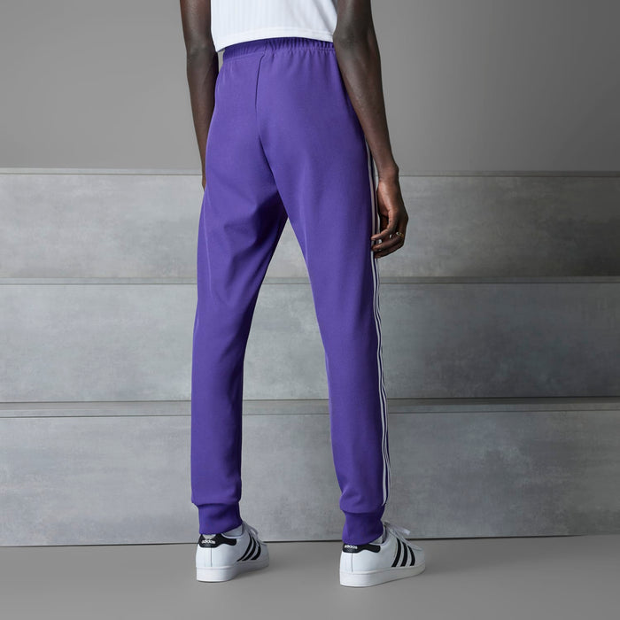 Purple track pants back view with white side stripes and ribbed ankle cuffs