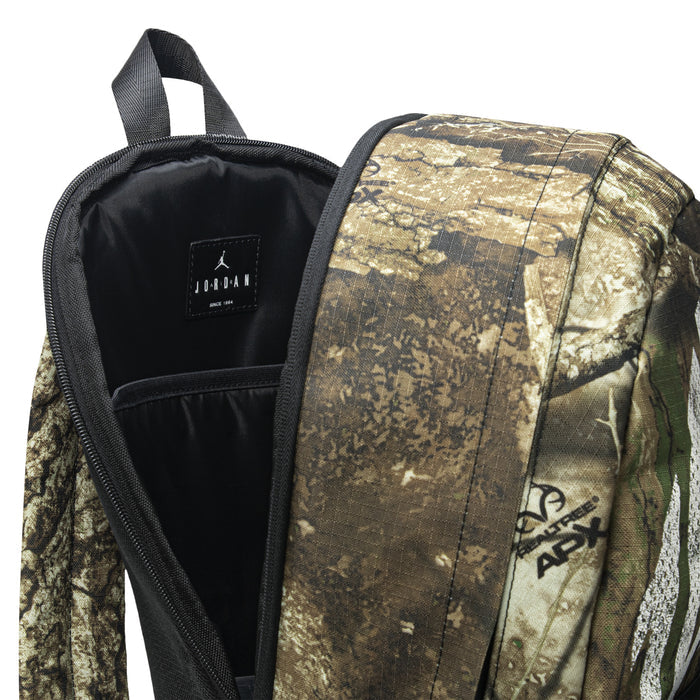 Camouflage daypack interior with black lining and JORDAN label on inner panel