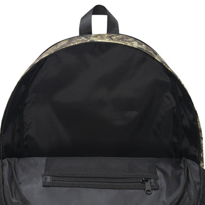 Camouflage daypack interior with top opening and zip pocket on black lining