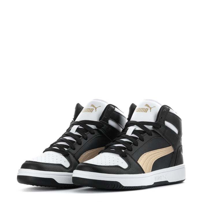Youth high-top sneakers pair, black and white with gold side panels and Puma logos