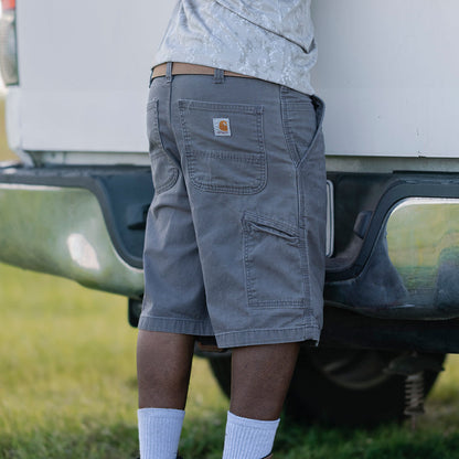 Men's relaxed fit dungaree shorts in gravel gray, back view with patch pockets