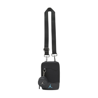 Black crossbody bag with adjustable shoulder strap and front zip pocket