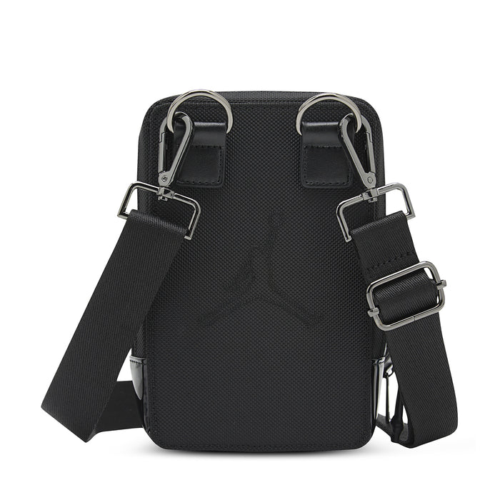 Black crossbody bag with dual D-ring straps and adjustable buckles