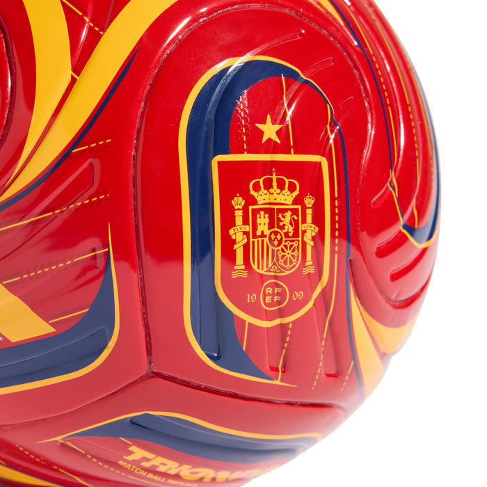 Red mini soccer ball close-up with Spain crest badge and star on central panel