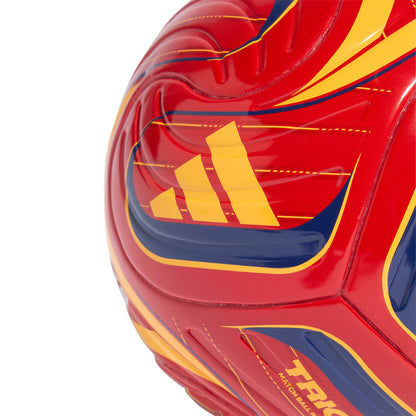 Red mini soccer ball close-up with yellow stripes and blue swoosh panel