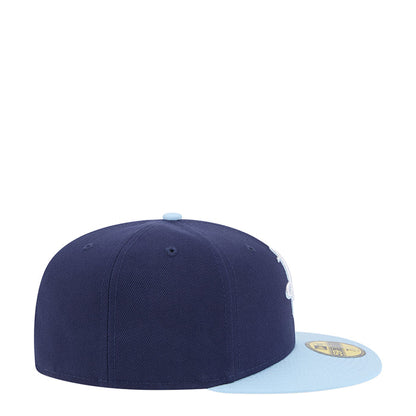 Two-tone baseball cap with dark navy crown and light blue brim, side Rockets mark.