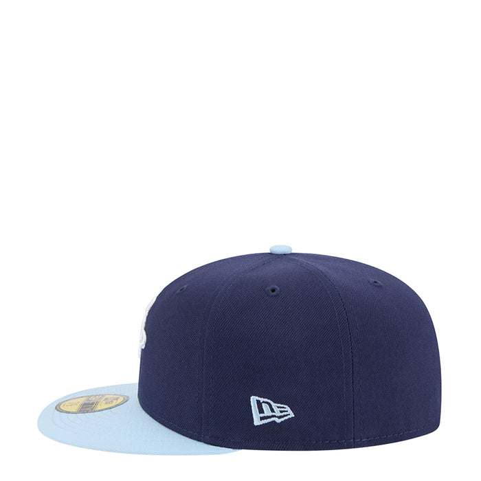 Two-tone cap with dark navy crown and light blue brim, New Era flag on side.