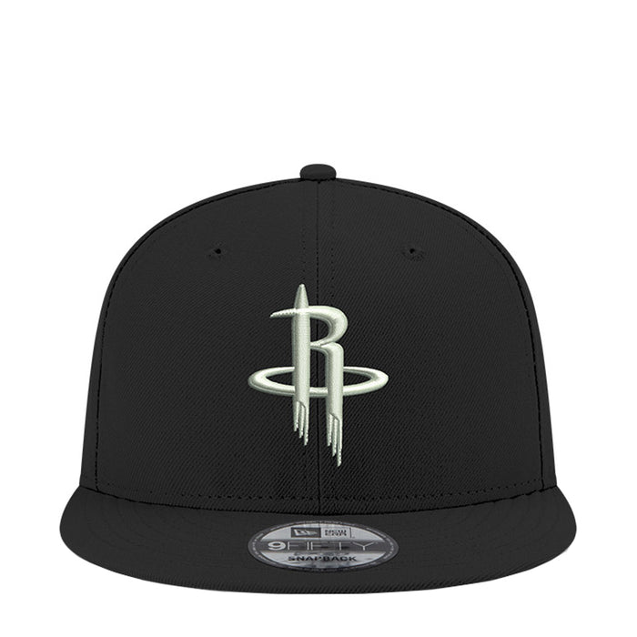 Black snapback cap with NBA Rockets logo on front panel, curved brim