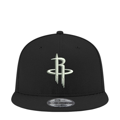 Black snapback cap with NBA Rockets logo on front panel, curved brim