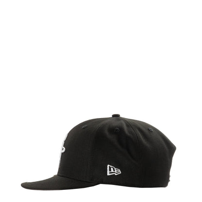 Black baseball cap with New Era logo on front panel, curved brim