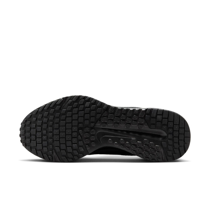 Black rubber outsole with deep tread pattern for grip, side view