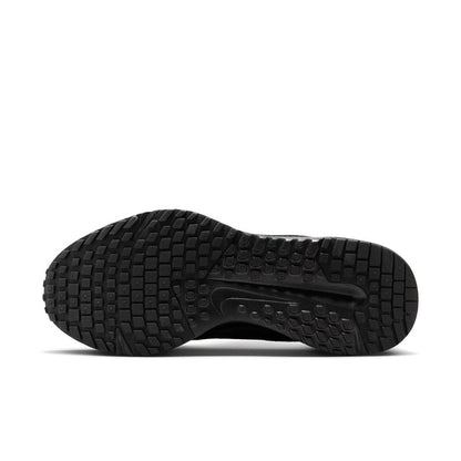 Black rubber outsole with deep tread pattern for grip, side view